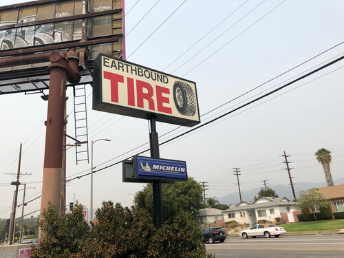 Earthbound Tire Sign